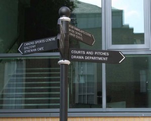 Black and silver fingerpost with modern font