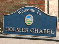 Boundary sign for Holmes Chapel